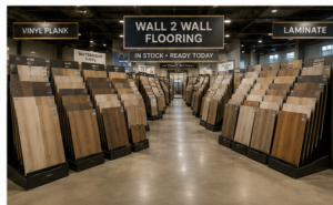 Wall 2 Wall showroom with rows of in-stock vinyl and laminate flooring samples ready for installation
